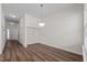 This dining room features sleek flooring and a modern chandelier at 604 Oakfield Trl, Mebane, NC 27302