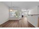 Open dining area with hardwood floors and door to the outside patio at 604 Oakfield Trl, Mebane, NC 27302