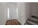 Bright entryway featuring wood-look flooring and carpeted stairs at 604 Oakfield Trl, Mebane, NC 27302