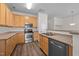 Efficient kitchen featuring stainless steel appliances and ample cabinet space at 604 Oakfield Trl, Mebane, NC 27302
