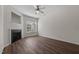 Bright living room with hardwood floors, a fireplace and a ceiling fan at 604 Oakfield Trl, Mebane, NC 27302