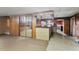 Basement area with mirrored closet doors and a bar counter, perfect for entertaining at 620 Mcghees Mill Rd, Roxboro, NC 27574