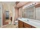 Bathroom featuring a vanity, a toilet, a shower and pink wall paper at 620 Mcghees Mill Rd, Roxboro, NC 27574