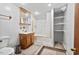 Updated bathroom featuring a vanity with sink and shower with white tiling at 620 Mcghees Mill Rd, Roxboro, NC 27574