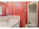 Bathroom featuring a vanity, a shower and red wall paper at 620 Mcghees Mill Rd, Roxboro, NC 27574