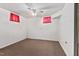 Bedroom with white walls, carpeted floor and a ceiling fan with dual windows for natural light at 620 Mcghees Mill Rd, Roxboro, NC 27574