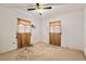 Bedroom featuring neutral carpet, ceiling fan and natural light from two windows at 620 Mcghees Mill Rd, Roxboro, NC 27574