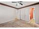 Bedroom featuring neutral carpet and view of the bathroom at 620 Mcghees Mill Rd, Roxboro, NC 27574