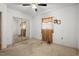 Bedroom featuring mirrored closet doors, ceiling fan, and natural light at 620 Mcghees Mill Rd, Roxboro, NC 27574