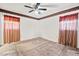 Bedroom featuring neutral carpet, ceiling fan, and two windows at 620 Mcghees Mill Rd, Roxboro, NC 27574