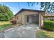 Attached brick carport with a covered side walkway and well-maintained landscaping at 620 Mcghees Mill Rd, Roxboro, NC 27574