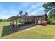 House exterior with car port, and flowers at 620 Mcghees Mill Rd, Roxboro, NC 27574
