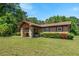 Single-story home with stone entrance, tidy landscaping, and a well-maintained lawn at 620 Mcghees Mill Rd, Roxboro, NC 27574