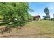 Inviting home with stone accents, mature trees, and well-maintained lawn at 620 Mcghees Mill Rd, Roxboro, NC 27574