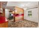 View of a retro kitchen featuring stainless steel appliances and a chandelier at 620 Mcghees Mill Rd, Roxboro, NC 27574