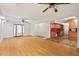 Bright living room features hardwood floors, stone fireplace, and an open layout to the kitchen at 620 Mcghees Mill Rd, Roxboro, NC 27574
