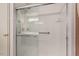 Shower with glass doors, grab bars and a shower seat at 620 Mcghees Mill Rd, Roxboro, NC 27574
