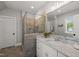 Bright bathroom features a glass-enclosed shower, granite countertops, and tiled flooring at 6208 Old Miravalle Ct, Raleigh, NC 27614