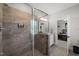 Large glass shower shows modern tile, shower products, and a view into the Primary bedroom at 6208 Old Miravalle Ct, Raleigh, NC 27614