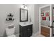 This bathroom features a sleek vanity and a modern design with a toilet in view at 6208 Old Miravalle Ct, Raleigh, NC 27614