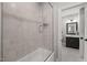 Light and bright bathroom features a tiled shower and en suite vanity with shower/tub combo at 6208 Old Miravalle Ct, Raleigh, NC 27614