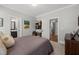 Spacious bedroom shows a glimpse of the bathroom and closet access at 6208 Old Miravalle Ct, Raleigh, NC 27614