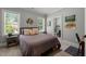 Comfortable bedroom with natural light, neutral colors, and en suite bathroom access at 6208 Old Miravalle Ct, Raleigh, NC 27614