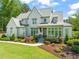 Beautiful two-story home featuring manicured landscaping and a welcoming front entrance at 6208 Old Miravalle Ct, Raleigh, NC 27614