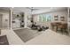 Spacious home gym includes modern exercise equipment, built-in storage, and natural light from a large window at 6208 Old Miravalle Ct, Raleigh, NC 27614