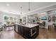 Modern kitchen with a large island, stainless steel appliances, and an open layout at 6208 Old Miravalle Ct, Raleigh, NC 27614