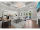 Expansive living room featuring hardwood floors and seamless kitchen integration at 6208 Old Miravalle Ct, Raleigh, NC 27614