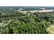 Overhead view of the home's location among dense trees, plus the property's nearby highway access at 726 Thomas Rd, Rocky Mount, NC 27801