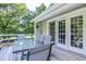 Back deck featuring a table and chairs with white doors leading inside at 726 Thomas Rd, Rocky Mount, NC 27801
