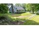 Spacious backyard with a wooden deck and chainlink fence at 726 Thomas Rd, Rocky Mount, NC 27801