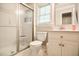Functional bathroom with a glass-enclosed shower, white vanity, and ample natural light at 726 Thomas Rd, Rocky Mount, NC 27801