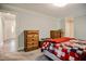Bedroom showcases a wood dresser and an entry doorway with light colored flooring at 726 Thomas Rd, Rocky Mount, NC 27801