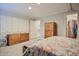 Well lit bedroom featuring a carpet, a dresser, and a walk-in closet at 726 Thomas Rd, Rocky Mount, NC 27801