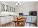 Cozy breakfast nook with a round table, chairs, and built-in cabinets with glass fronts at 726 Thomas Rd, Rocky Mount, NC 27801