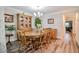 Charming dining room with a wooden table, chairs, and a china cabinet at 726 Thomas Rd, Rocky Mount, NC 27801