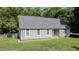 Ranch home with a new gray roof, fresh paint, and a meticulously maintained lawn at 726 Thomas Rd, Rocky Mount, NC 27801