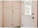 Hallway cabinets with drawers and view of the front door at 726 Thomas Rd, Rocky Mount, NC 27801