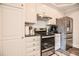 Modern kitchen featuring stainless steel appliances, granite countertops, and white cabinets at 726 Thomas Rd, Rocky Mount, NC 27801