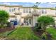 This home features a patio with seating, a lush green lawn, and privacy landscaping at 7611 Satinwing Ln, Raleigh, NC 27617