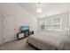 Well-lit bedroom featuring a TV, large windows, and two closets for ample storage space at 7611 Satinwing Ln, Raleigh, NC 27617