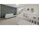Bright Bedroom featuring a daybed, crib, and star wall decals, creating a whimsical and peaceful space at 7611 Satinwing Ln, Raleigh, NC 27617