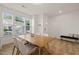 Bright dining area boasts natural light, and hardwood floors at 7611 Satinwing Ln, Raleigh, NC 27617