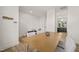 Spacious dining area boasts hardwood floors and access to the kitchen at 7611 Satinwing Ln, Raleigh, NC 27617