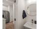 Modern powder room features a floating vanity, a round mirror, and stylish fixtures at 7611 Satinwing Ln, Raleigh, NC 27617