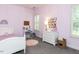 Cute bedroom with lavender walls, white furniture, and a plush carpet at 800 Skymont Dr, Holly Springs, NC 27540