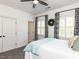 Charming bedroom with white walls, plush carpet, and stylish decor at 800 Skymont Dr, Holly Springs, NC 27540